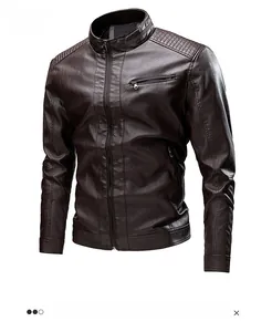 Detail of dark brown faux leather jacket featuring ribbed shoulder stitching and zipper pockets