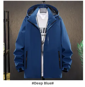 Detail view of deep blue waterproof hiking jacket with hood and X-SPORT zipper logo