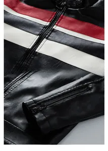 Detail of biker leather jacket featuring red and white patchwork and zippered cuffs