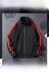 Detail of black sports jacket featuring three red stripes and a stand collar design