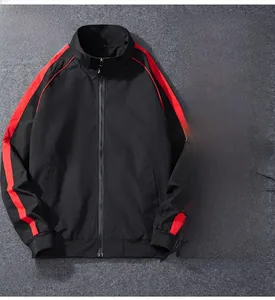 Close-up of black sports jacket with red sleeve stripes and ribbed stand collar detail