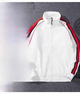 Detail of white sport jacket showing stand collar, zipper, and red-black side stripes