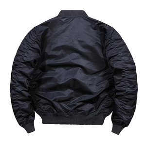 Detail view of black bomber jacket featuring ruched sleeve design and ribbed cuffs