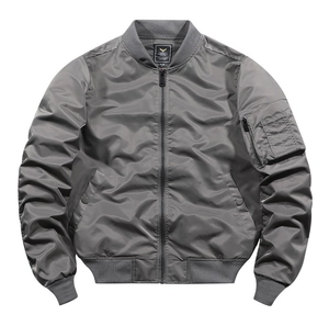 Detail of grey MA-1 flight jacket showing ribbed collar and signature utility sleeve pocket