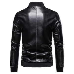 Detail view of the back seams and knitted ribbed hem on a black PU leather jacket