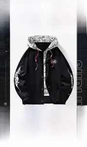 Detail view of hooded baseball jacket showing black and white paisley pattern lining and snaps