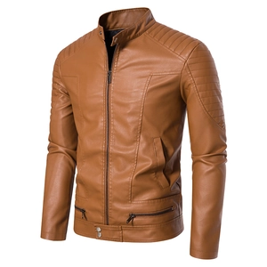 Detail view of brown PU leather jacket featuring quilted shoulders and zipper pockets