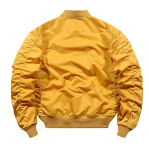 Rear view of yellow bomber jacket featuring ruched sleeve detailing and ribbed hem