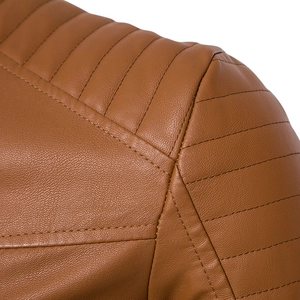 Detailed close-up of quilted shoulder stitching on men's vintage brown PU leather jacket