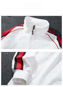 Detail view of sports jacket with color-block stand collar and striped ribbed cuffs