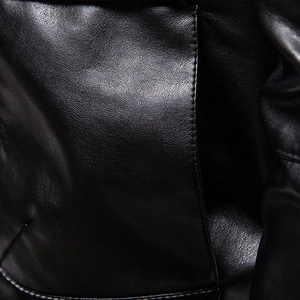 Detailed close-up of premium black PU leather jacket with lychee texture and stitching