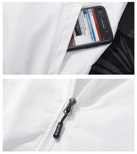 Detail of spacious side pocket for smartphone and sports zipper puller on white jacket