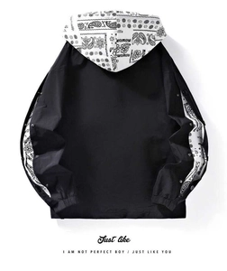 Detail of hooded jacket with paisley print inner hood and contrast sleeve cuffs