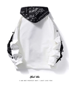 Detail of white streetwear hoodie showing paisley print hood and snap button sleeves