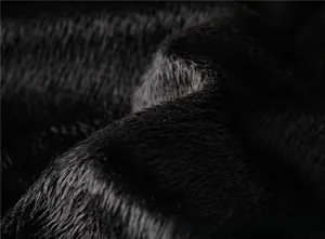 Macro shot of premium black faux fur lining with dense plush texture for men jacket