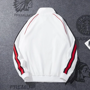 White tracksuit jacket with red and black stripes on sleeves and a stylish stand collar