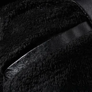 Detailed close-up showing the texture of black faux leather and soft sherpa lining material