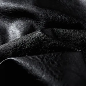 Close-up detail of high-quality black faux leather texture on men motorcycle jacket