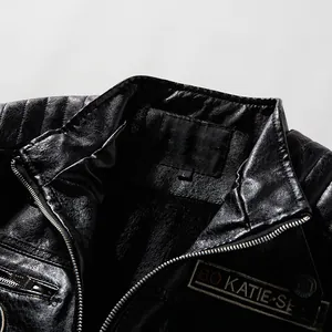 Detail of men's black PU leather jacket with fleece lining and quilted shoulder texture