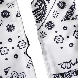 Black and white paisley print varsity jacket detail showing premium stitching and fabric