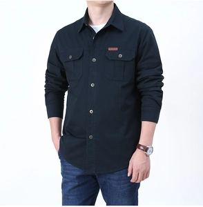 Detailed close-up of blue fleece-lined shirt featuring double chest pockets and outdoor label