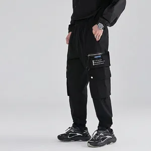 Men's black tactical cargo pants with elastic waist and side pockets in street style