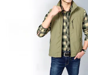 Detail view of army green outdoor vest featuring stand collar and vertical zipper chest pocket