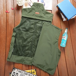 Detail view of military green fishing vest with breathable mesh back and removable panel