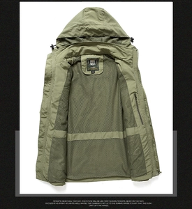 Detail view of military green outdoor jacket with breathable black mesh lining and hood