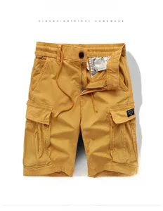 Detailed view of khaki cargo shorts showing cotton twill fabric and elastic drawstring waist