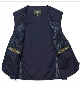 Detail of the navy outdoor vest featuring breathable mesh lining and orange brand webbing