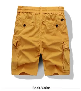 Detail view of mustard yellow cargo shorts showing elastic waist and back button pockets