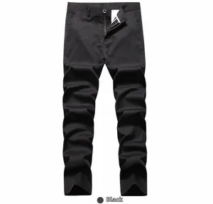 Detail view of men's black straight cotton trousers with metal button and zipper closure