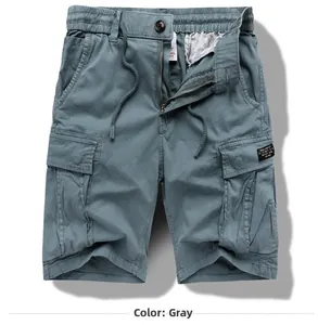 Detailed view of grey cargo shorts with elastic drawstring waist and large side pockets