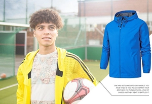 Detail view of blue men's outdoor jacket with adjustable velcro cuffs and zip-up hood