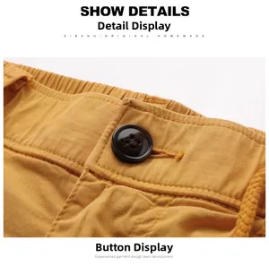 Macro shot of ginger yellow cargo shorts featuring elastic waistband and button closure