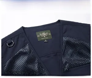 Detailed V-neck view of navy blue multi-pocket fishing vest with mesh stitching