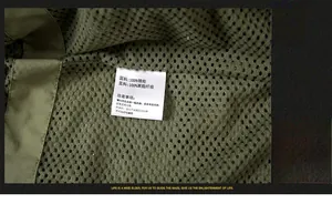 Close-up of mesh lining and care label showing 100% nylon material for waterproof jacket