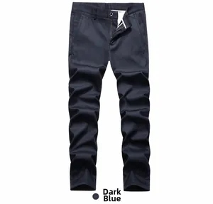 Detail view of dark blue men's casual trousers with metal button and zipper closure