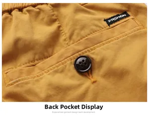 Detail of cargo shorts showing ginger yellow twill fabric and buttoned rear pocket