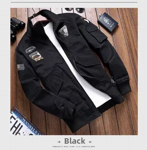 Close-up of black tactical jacket featuring military badges and durable metal zipper