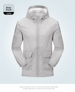 Detail of gray lightweight sun protection jacket with hood, zipper and utility pockets