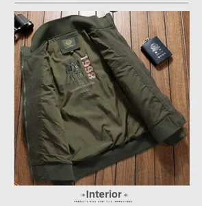 Detail view of olive green military bomber jacket with vintage printed polyester lining