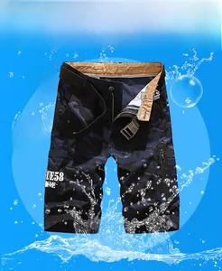 Detail view of cargo shorts side zipper pocket with camouflage pattern and woven belt