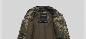 Close-up of military camouflage jacket collar with woodland pattern and brand label
