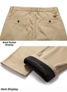 Detail of khaki men's casual pants showing the fleece lining and rear pocket with label