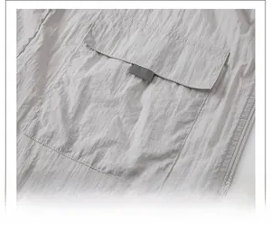 Close-up of lightweight outdoor sun protection jacket with a large square pocket design