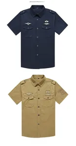 Detail of military style cotton shirts featuring shoulder straps and utility chest pockets