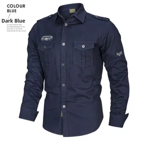 Detail of dark blue tactical shirt with epaulets, chest pockets and embroidered patches