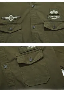 Detailed close-up of military green cotton shirt featuring embroidered star patches and pockets